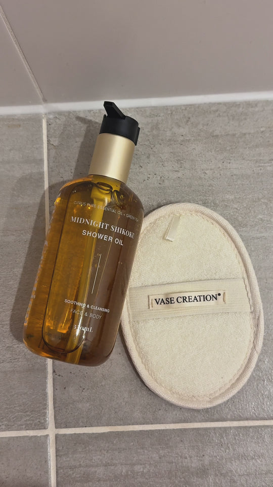 Midnight Shikoku Shower Oil and Bio-Fiber Loofah Pad in the shower, customer video